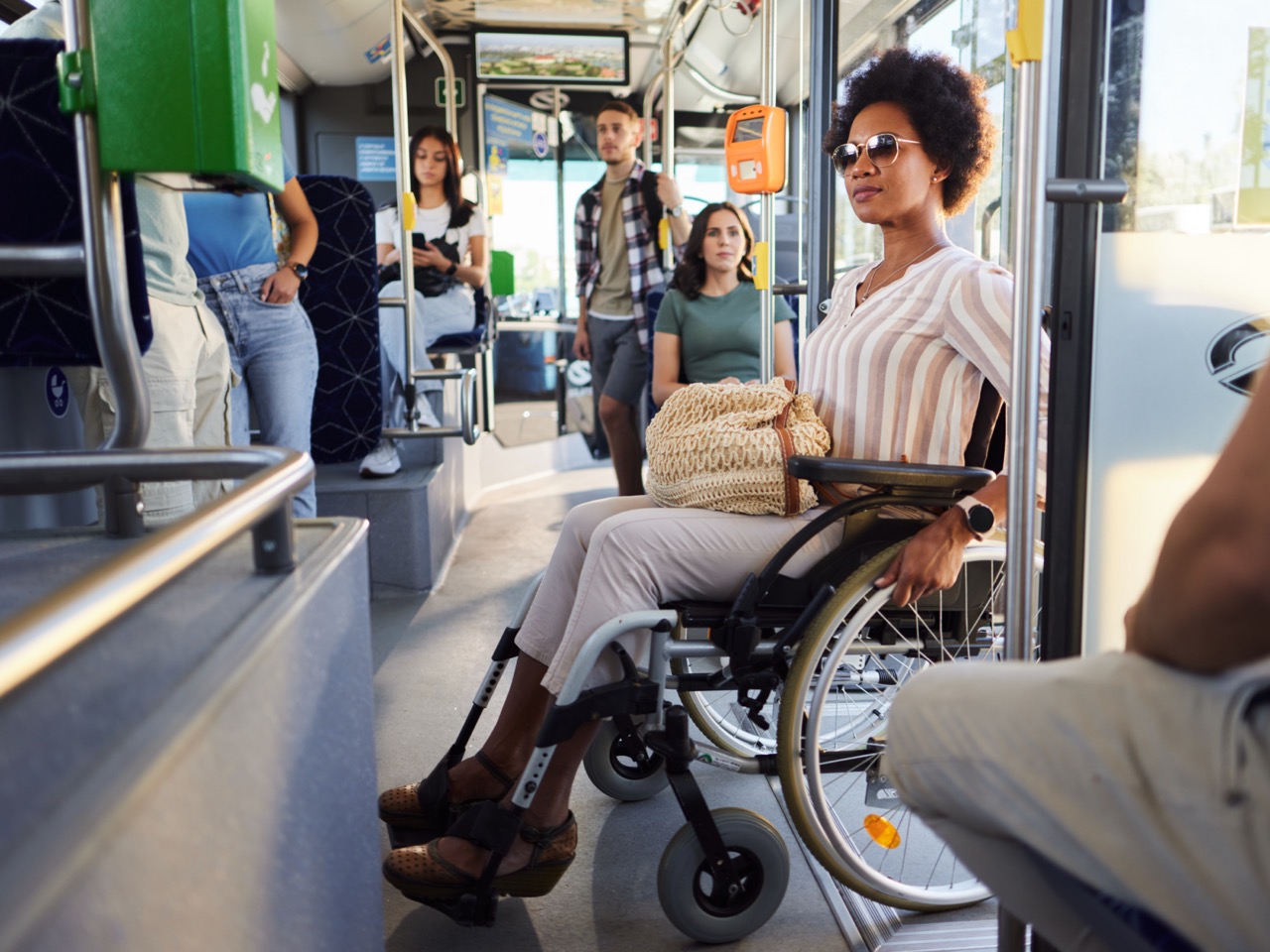 photo of woman in wheelchair on public bus